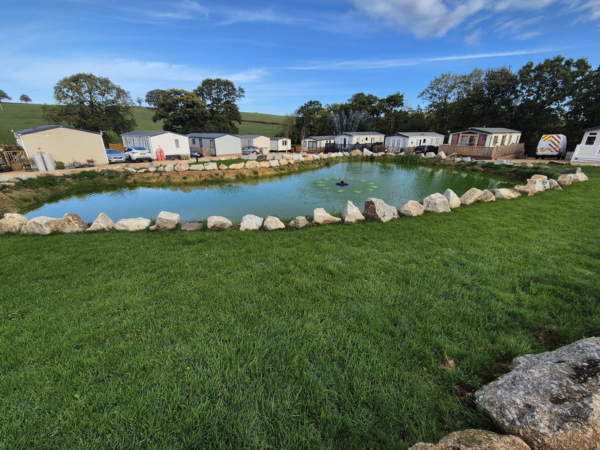 Site image overlooking pond and vans2